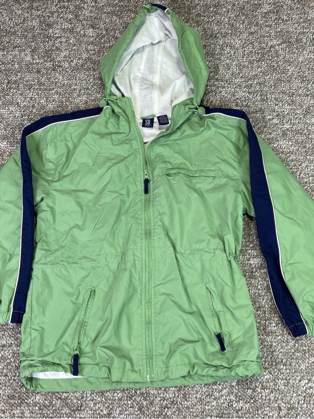 Green Hooded Windbreaker Jacket with Navy Trim  and a hood.